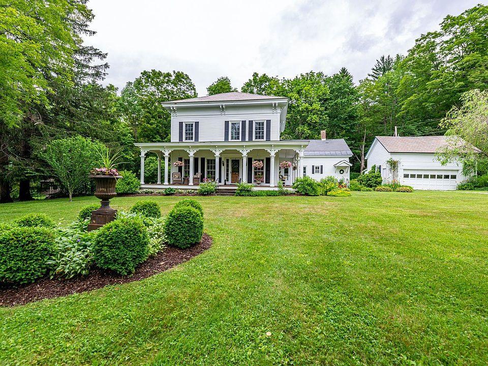 Large older home with an expansive lawn requiring regular property maintenance